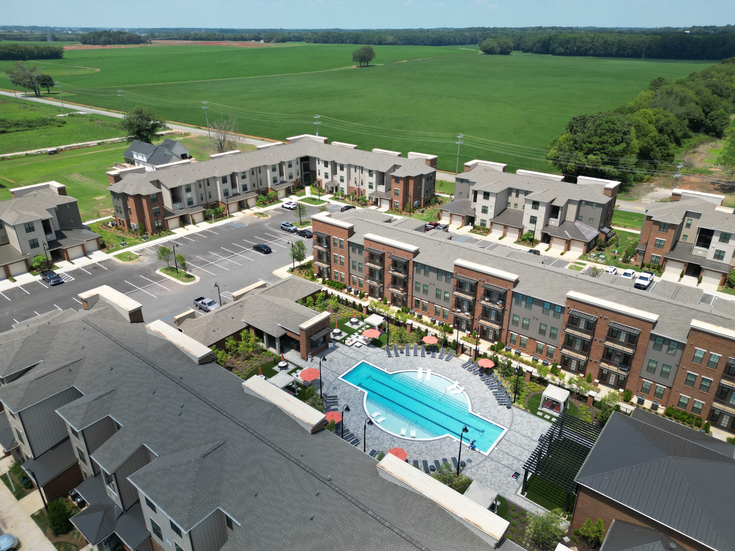 bird eye view of apartment complex and pool