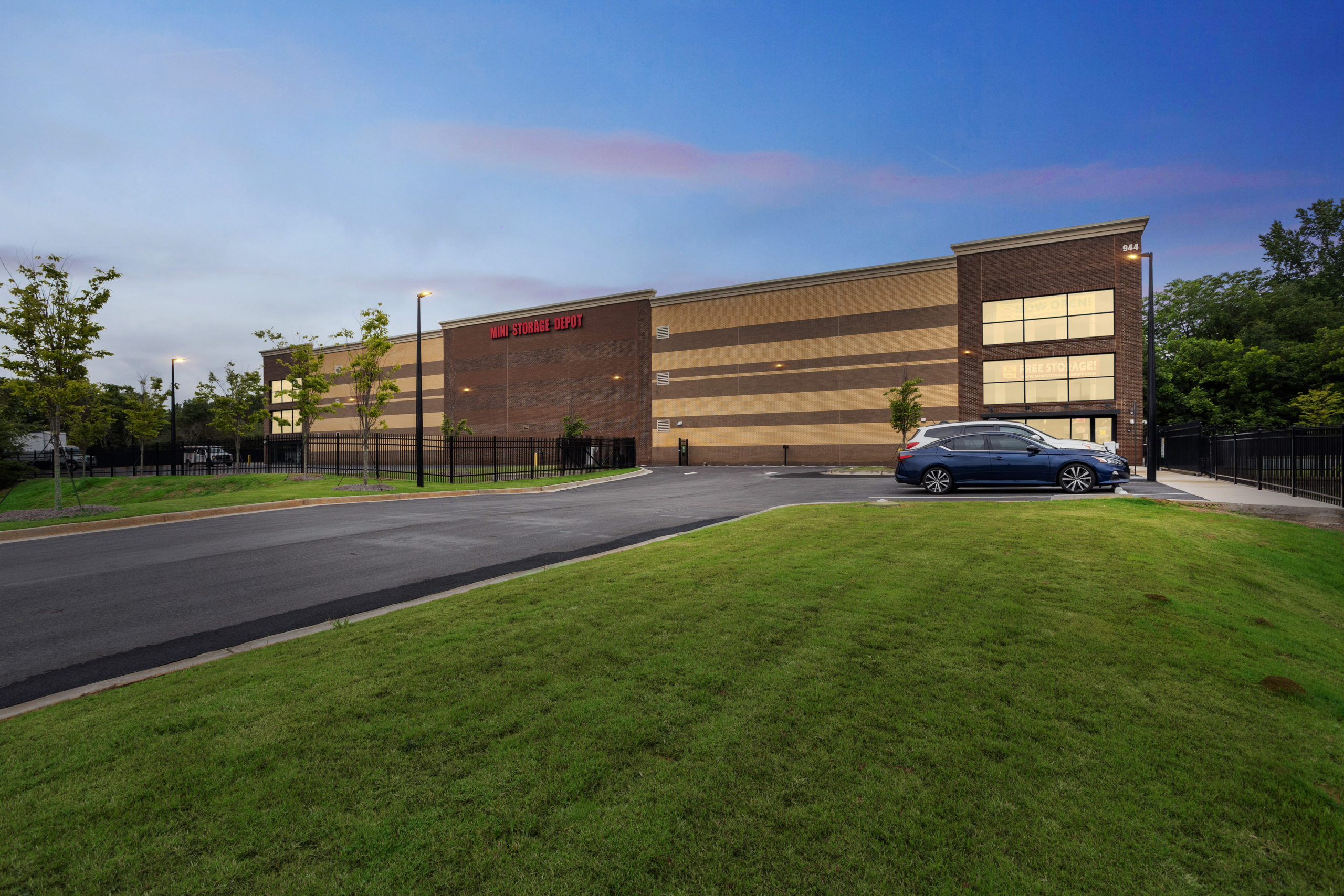 exterio image of lawn leading up to mini storage depot leasing office